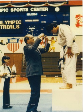 Rene Henry awards medals at the US Olympic Trials for Judo at Colorado Springs.