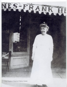 Marie Henry in front of the Frank Henry store in South Charleston.
