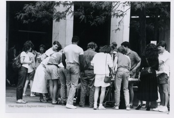 A group of people signing letters at the Block Bork protest in Morgantown.