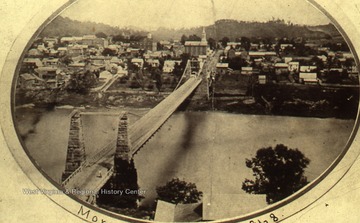 Built in 1868. 1868 view with suspension bridge.