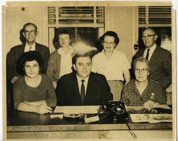 Herman Walker (center), county clerk and postmaster, at the Morgantown Post Office.