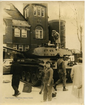 The Veterans of Foreign Wars presenting a tank to the children attending.