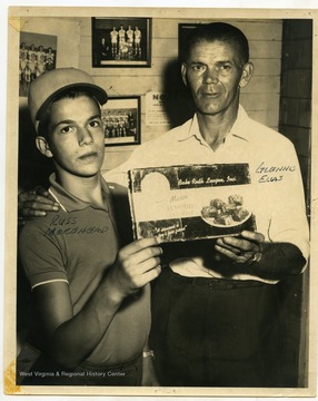 Russ Moorehead and Glennis Elias advertising Babe Ruth League Mason's Almond Coconut bars.