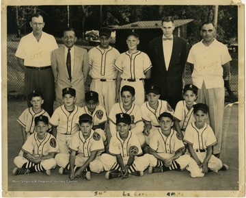 A photo of the 1954 Kiwanis Little League Championship baseball team with Coach Clyde Selby (far right).